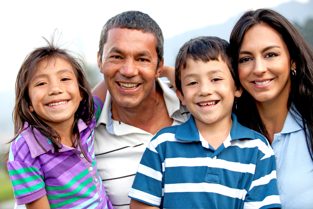 Beautiful family portrait looking happy and smiling outdoors