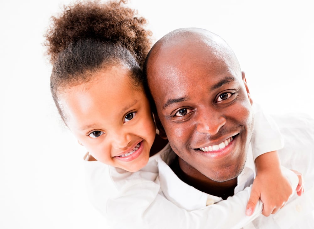 Cute portrait of a father and daughter - isolated over white